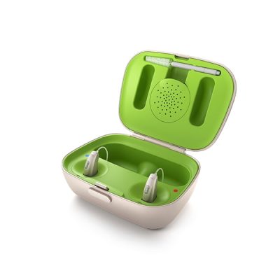 A pair of hearing aids sit in an open Phonak Charger Case, which is green and white and features storage compartments and a built-in cleaning brush inside the lid.