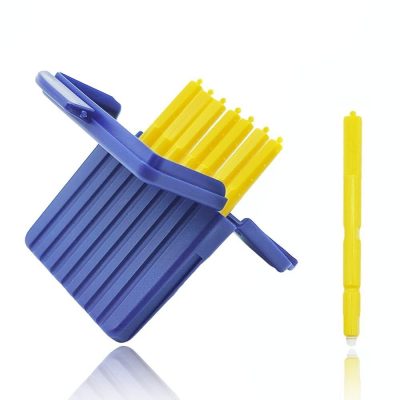 A blue plastic case containing multiple yellow Hear Clear Waxguard picks, with one yellow pick displayed separately beside the case on a white background—resembling typical Hear Clear Waxguard packaging.