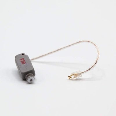 A small gray electronic component labeled PAR, the Easywear wired RIC (P-Receiver), with a short, thin wire ending in a clear plastic connector, is shown on a plain white background.