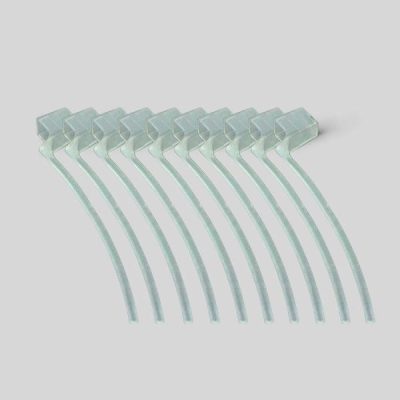 Eight clear plastic cable ties for Concha Lock installations are neatly arranged in a slightly fanned-out row on a plain light gray background.
